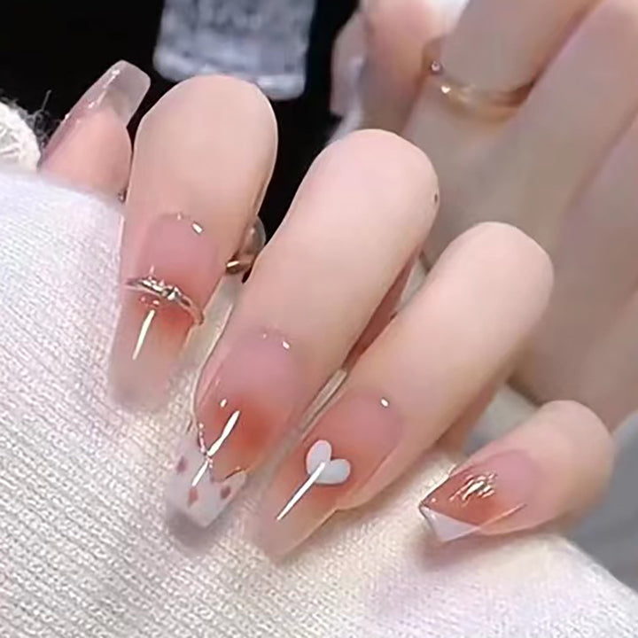 Elegant Long Press-On Nails with Artistic Heart and Gem Accents Bowlift