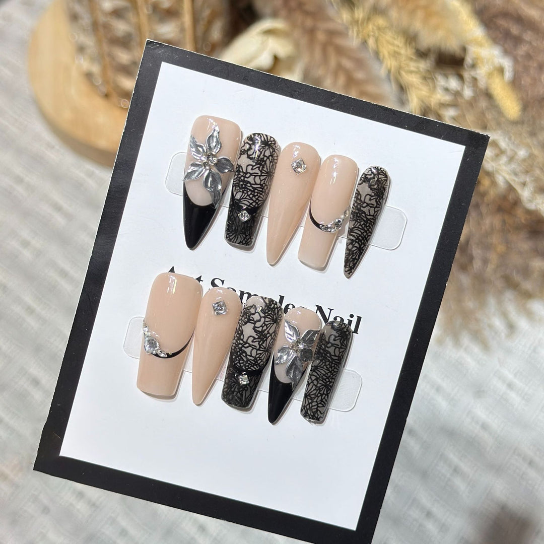 Artistic Stiletto Press-On Nail Set with Floral and Geometric Accents Bowlift