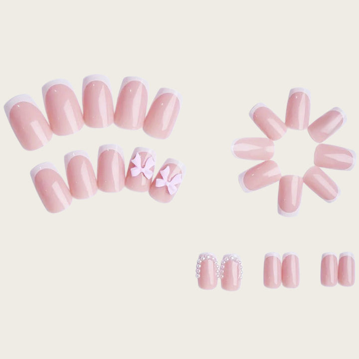 Exclusive artificial nails with decorative bows and pearl details Bowlift