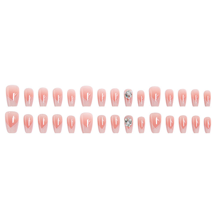 Artificial nail set with filigree tip designs and glamorous rhinestone accents Bowlift