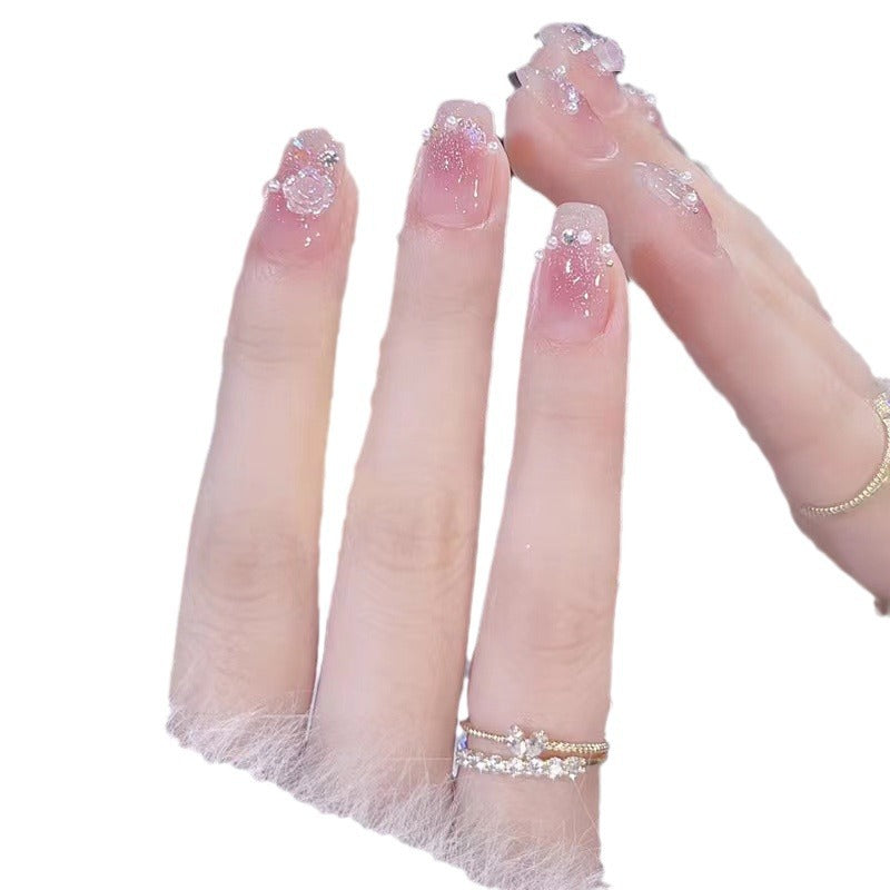 Glamorous nail art with rhinestone and pearl accents Bowlift
