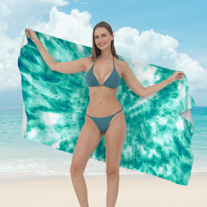 Beach towel with vibrant tropical plant motif Bowlift