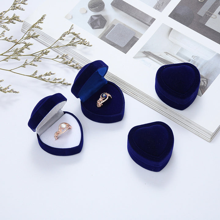 Heart-shaped velvet ring box with cushioned white interior and secure ring slot Bowlift