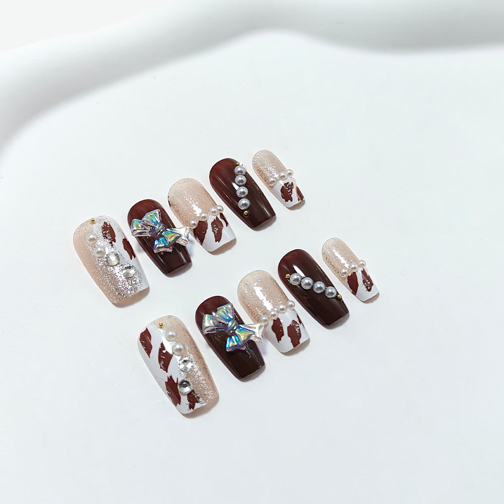 Artificial nails with glamorous rhinestone and bow design Bowlift
