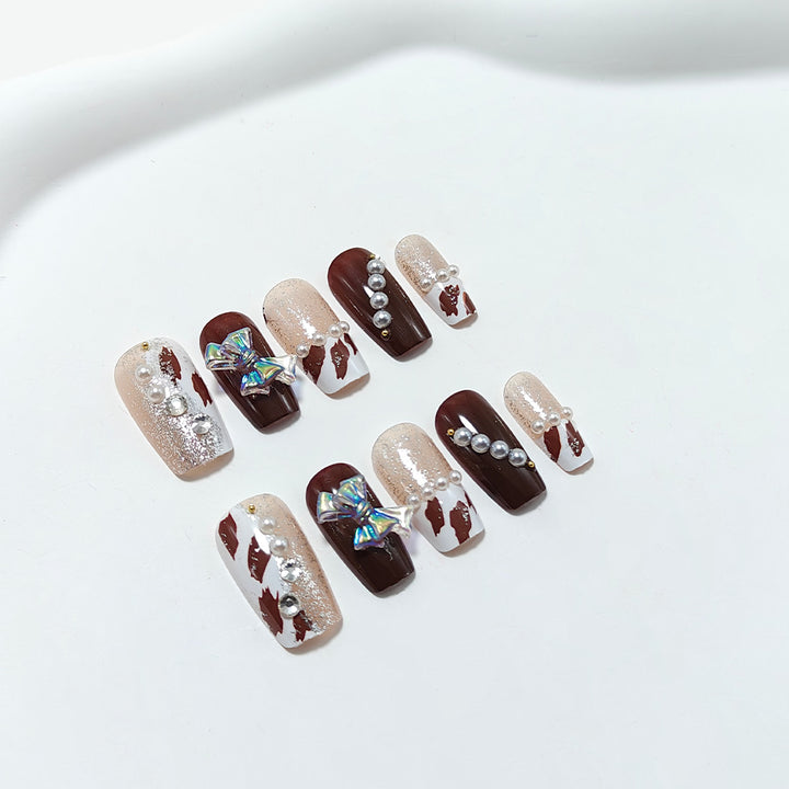 Artificial nails with glamorous rhinestone and bow design Bowlift