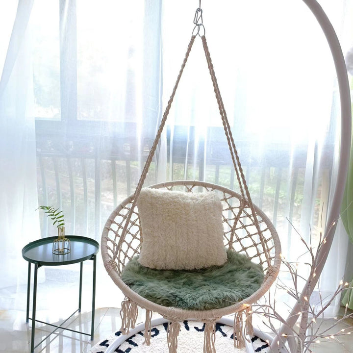Boho macrame hanging swing chair with faux fur cushion and fringe Bowlift