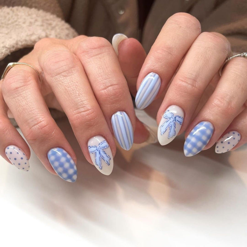 Artful Nail Art with Flower Design and Blue French Tip Bowlift