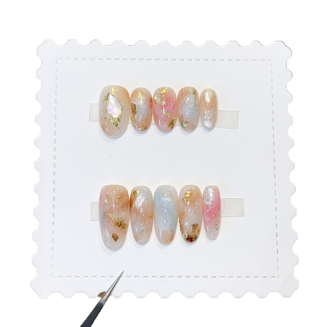 Artificial nails with glamorous metallic details and sparkling design Bowlift