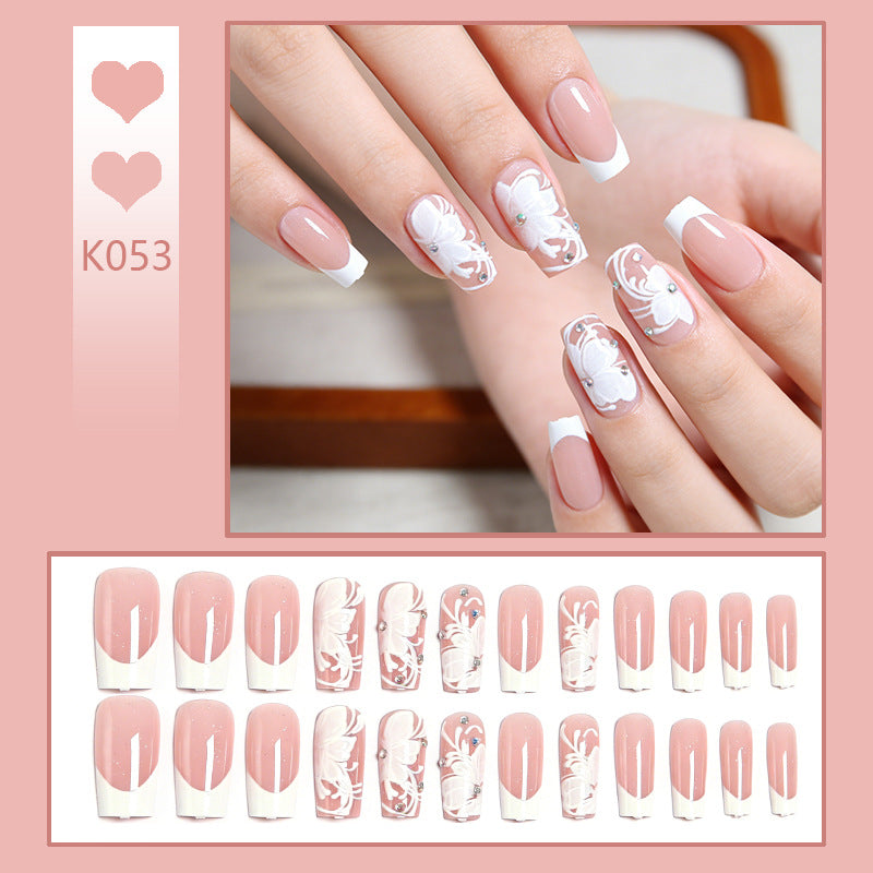 Artificial nails with floral embellishments and glitter details Bowlift