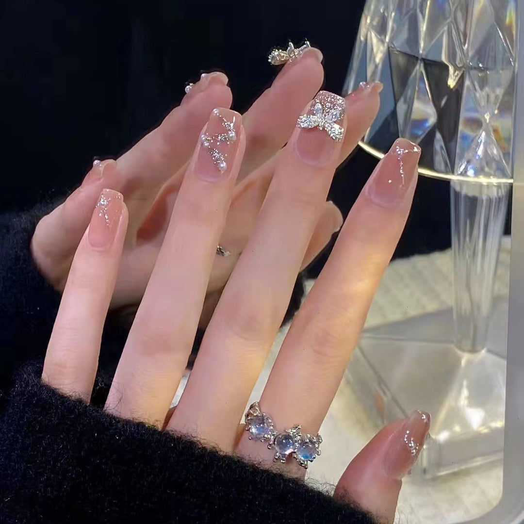 Artificial nails with heart design and glitter accents Bowlift