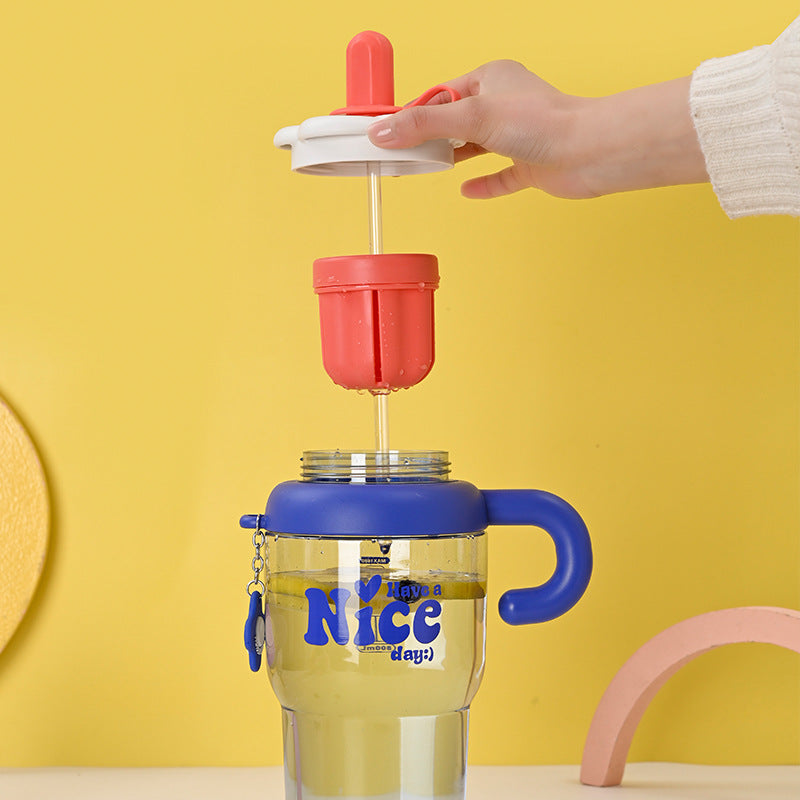 Unisex drinking cup with integrated straw and spill protection Bowlift