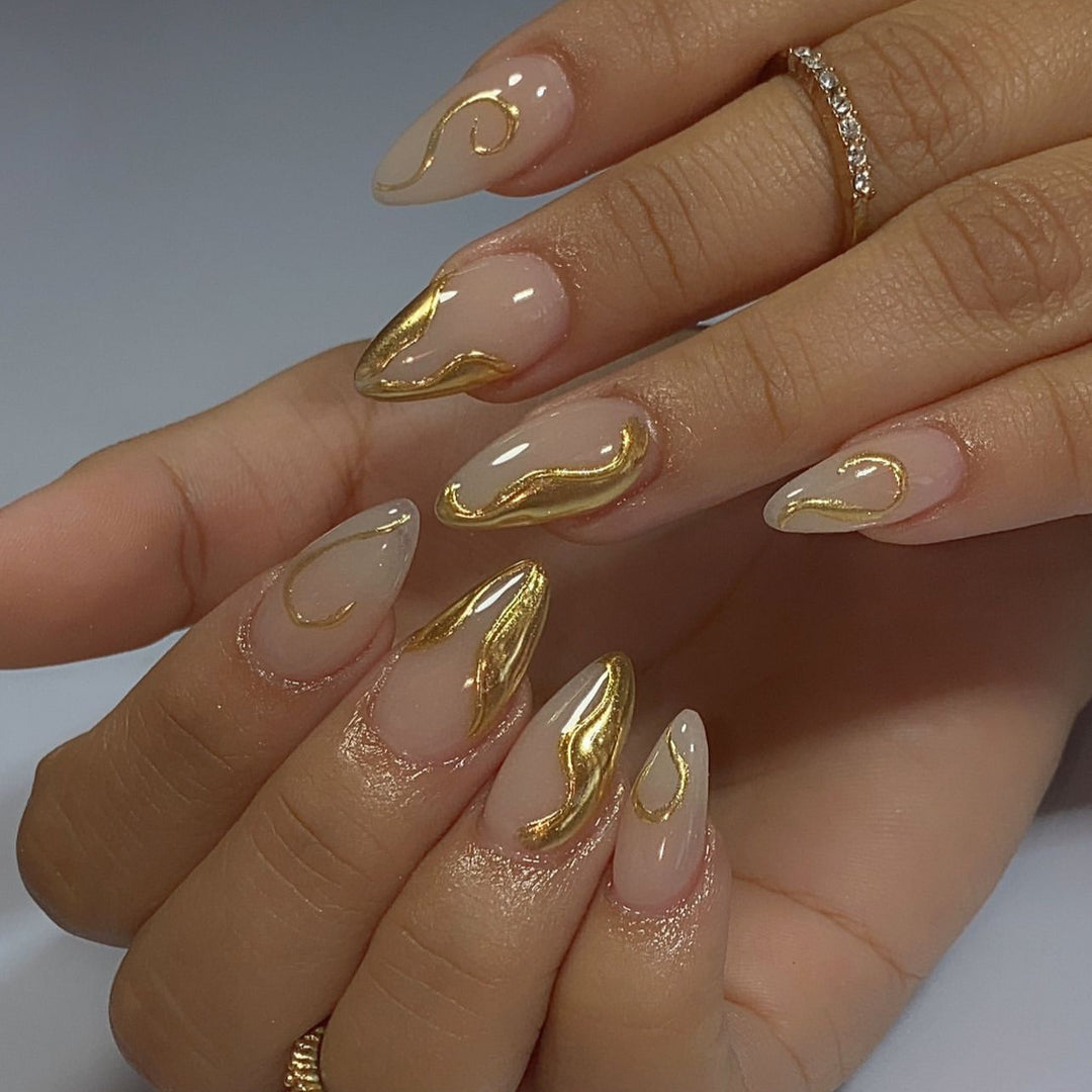 Artistic Stiletto Nails with Elegant Gold Accents Bowlift