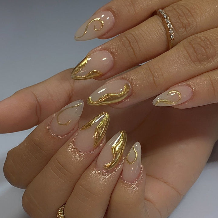 Artistic Stiletto Nails with Elegant Gold Accents Bowlift