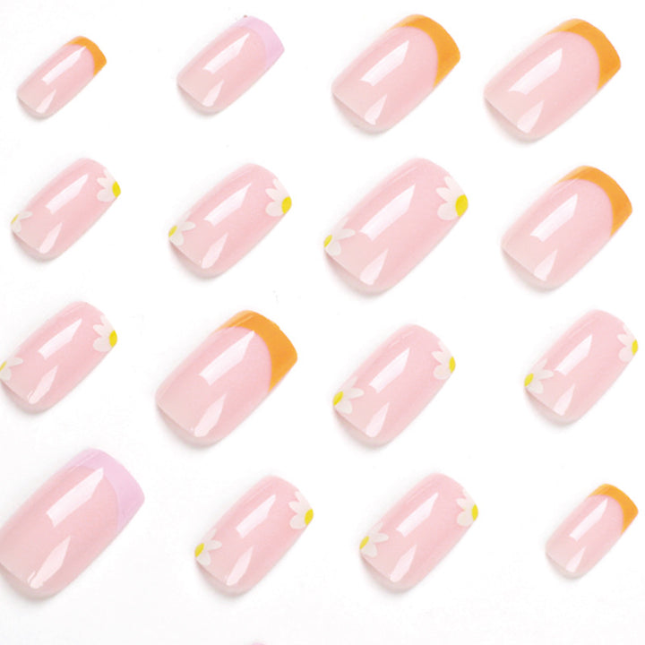 Artistic acrylic nails with floral design and creative color accents Bowlift