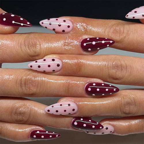 Artful Nail Extensions with Dots and Elegant Accents Bowlift