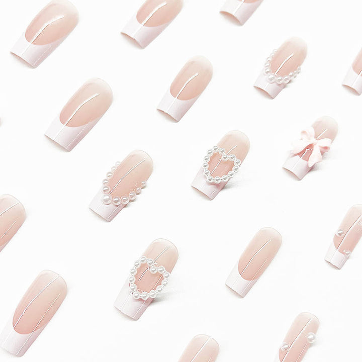 Artificial nail set with elegant 3D flowers and pearl embellishments Bowlift