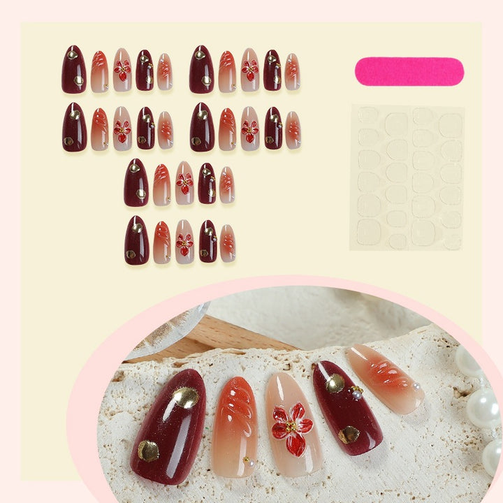 Acrylic nail set with elegant floral accents and glitter details Bowlift