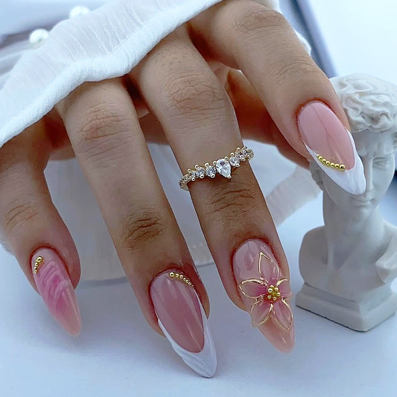 Acrylic nail set with floral design and elegant embellishments Bowlift