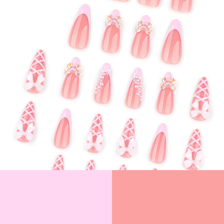 Artful stiletto nails with glitter and bow decoration Bowlift