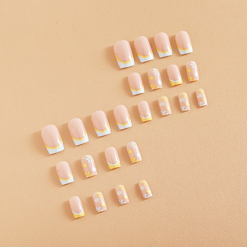 Nail art set with creative floral designs and elegant French finish Bowlift