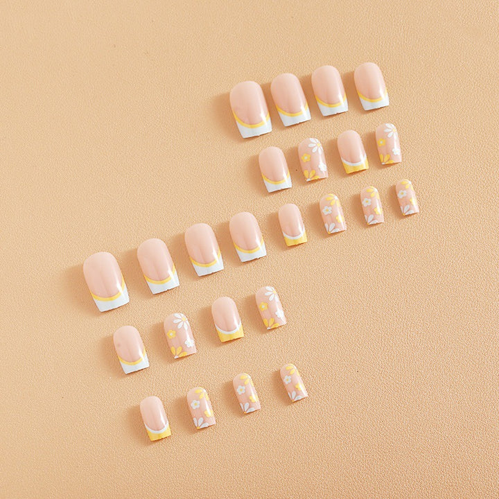Nail art set with creative floral designs and elegant French finish Bowlift