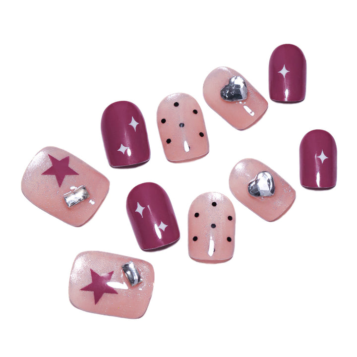 Artificial nail extensions with unique jewelry accents Bowlift