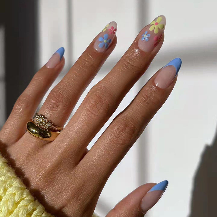 Artificial nail art with floral design and gradient Bowlift