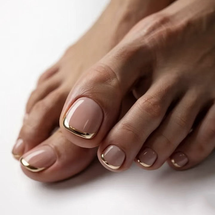 Artful toenail art with golden accents Bowlift