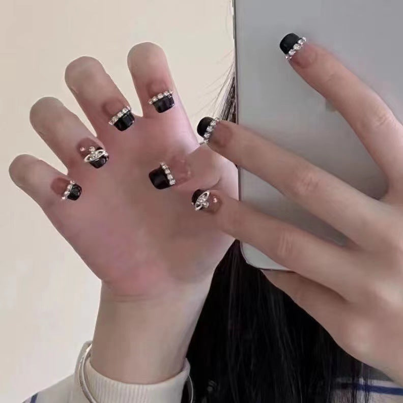 Glamorous nail art with rhinestone embellishments Bowlift