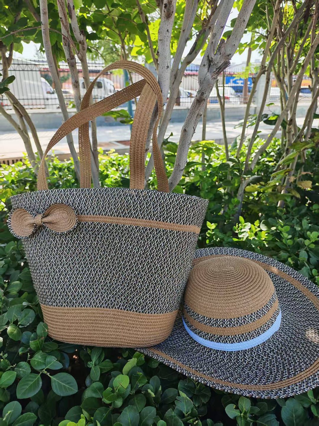 Elegant sun hat with wide brim and subtle stripe pattern Bowlift