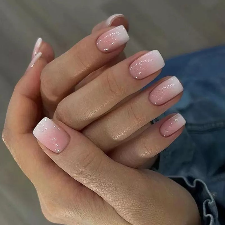 Acrylic nail set with elegant ombre design and glitter accents Bowlift