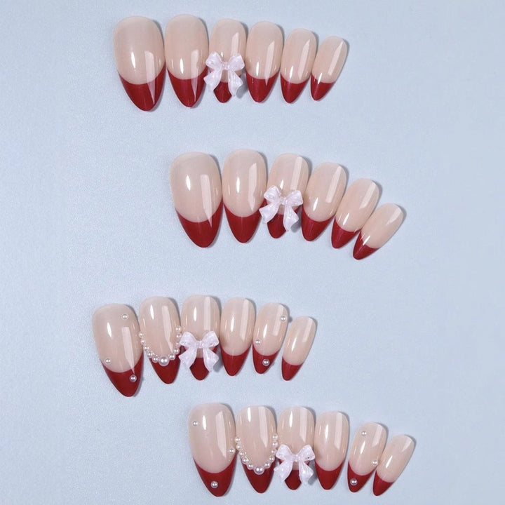 Artificial nail set with glamorous rhinestone and bow decorations Bowlift