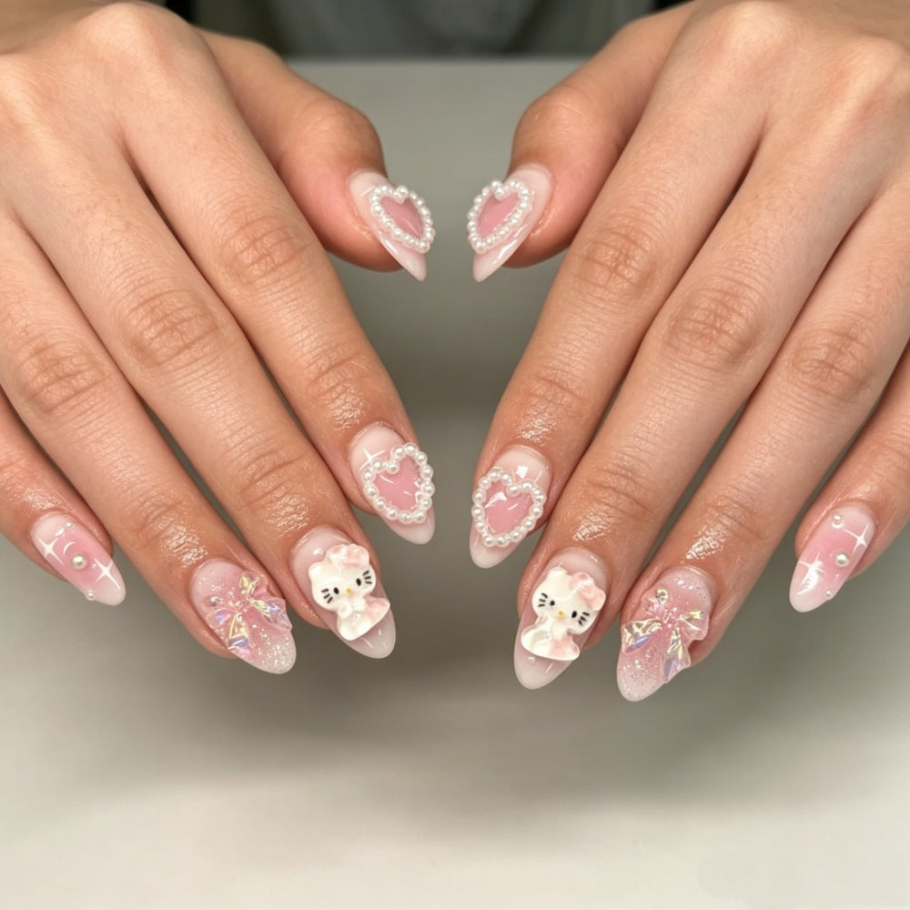 Playful artificial nails with heart and kitty motifs Bowlift