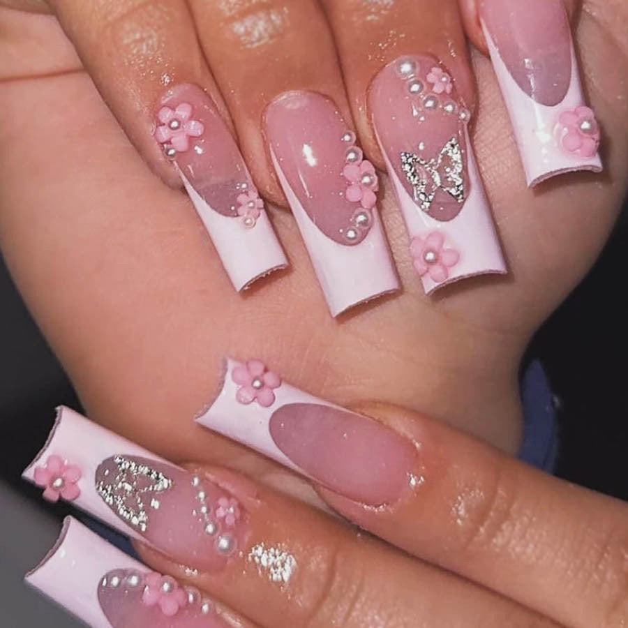 Artificial nail set with playful 3D flowers and glitter accents Bowlift