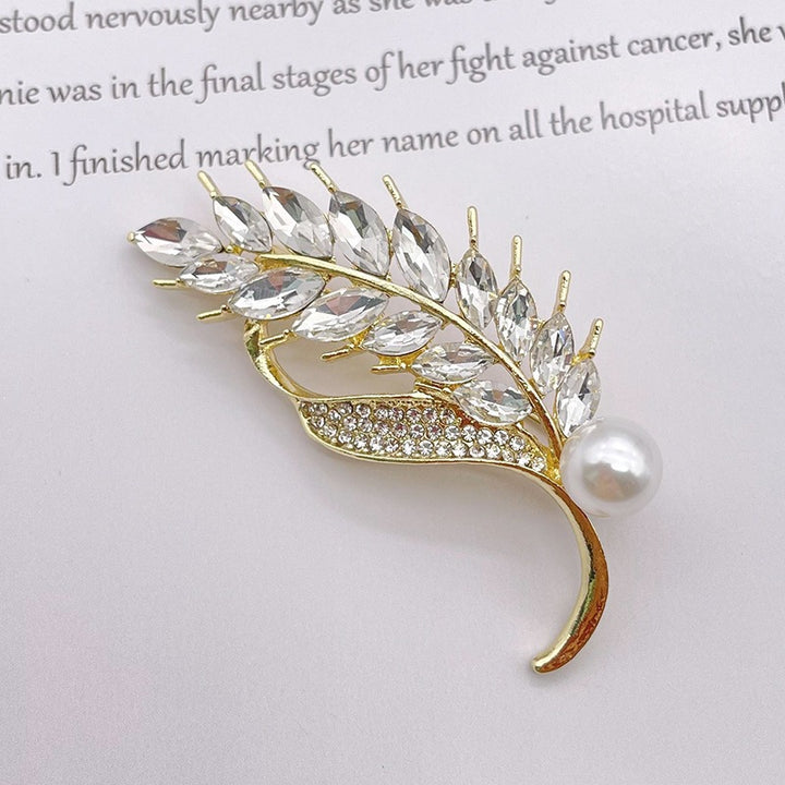 Elegant brooch with glitter stone and pearl Bowlift