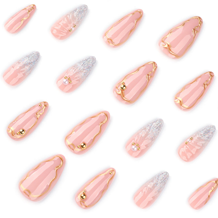 Artful stiletto nails with elegant gold embellishment design Bowlift