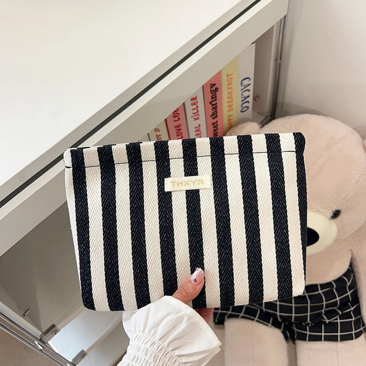 Striped canvas zippered cosmetic pouch clutch with padded lining and wristlet Bowlift