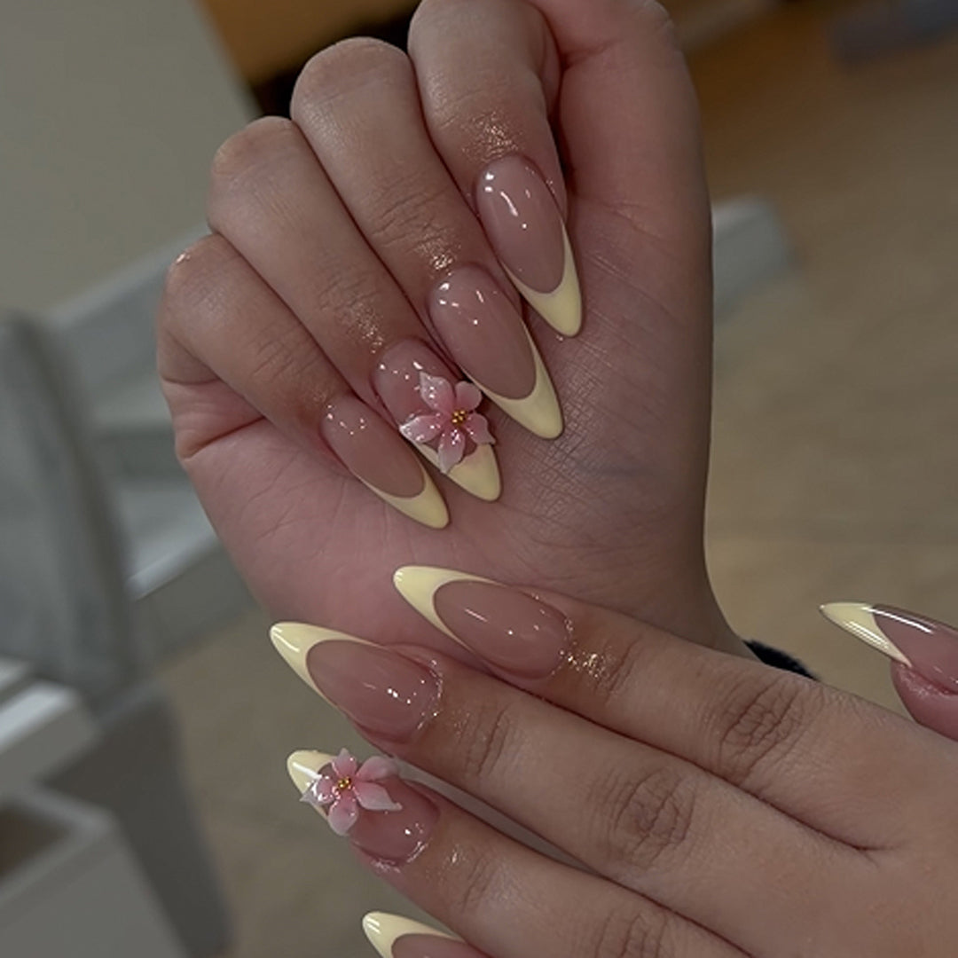 Artful stiletto nails with elegant flower accent Bowlift