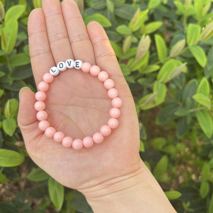 Friendship bracelet made of pastel beads Bowlift