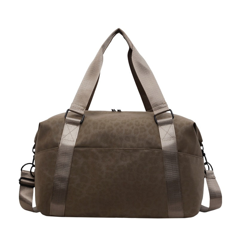 Sporty duffel bag with animal pattern and practical carrying options Bowlift