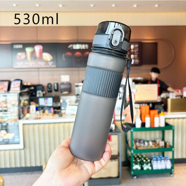 Ladies practical and leak-proof drinking bottle with integrated carrying strap Bowlift