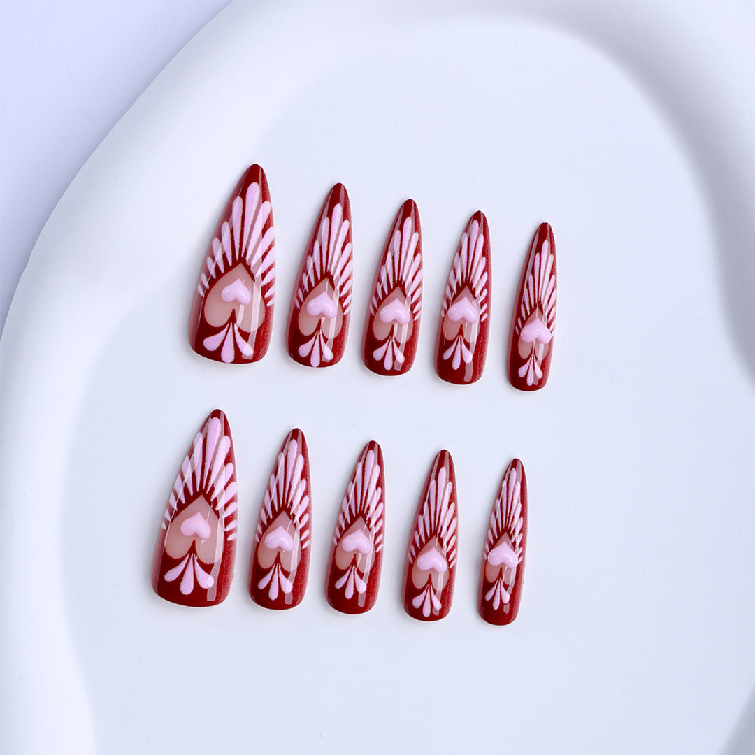 Artificial nails with playful heart design and elegant accents Bowlift