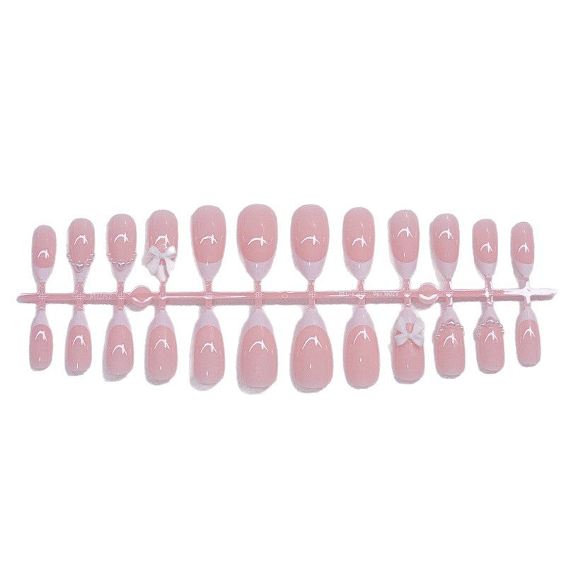 Elegant artificial nails with curved tips and decorative bows Bowlift