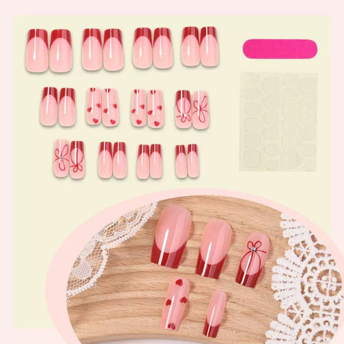 Artificial nail set with romantic heart and bow motifs Bowlift