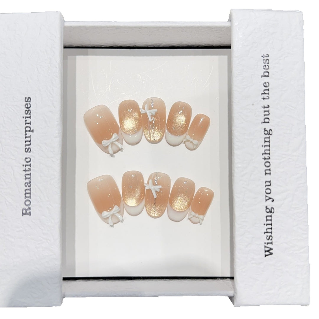 Artificial nails with romantic bow and glitter effects Bowlift