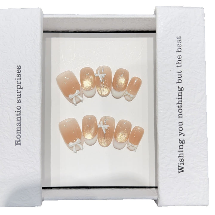 Artificial nails with romantic bow and glitter effects Bowlift