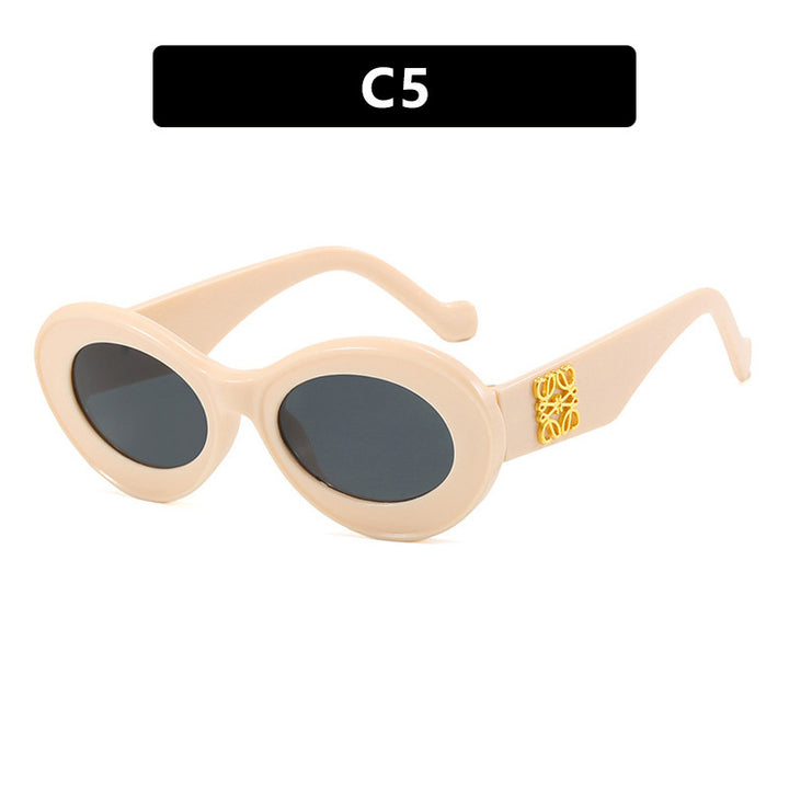 Women's fashionable sunglasses with oval frame and golden accents Bowlift