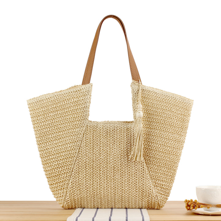 Beach bag made of natural weave with elegant leather accents Bowlift