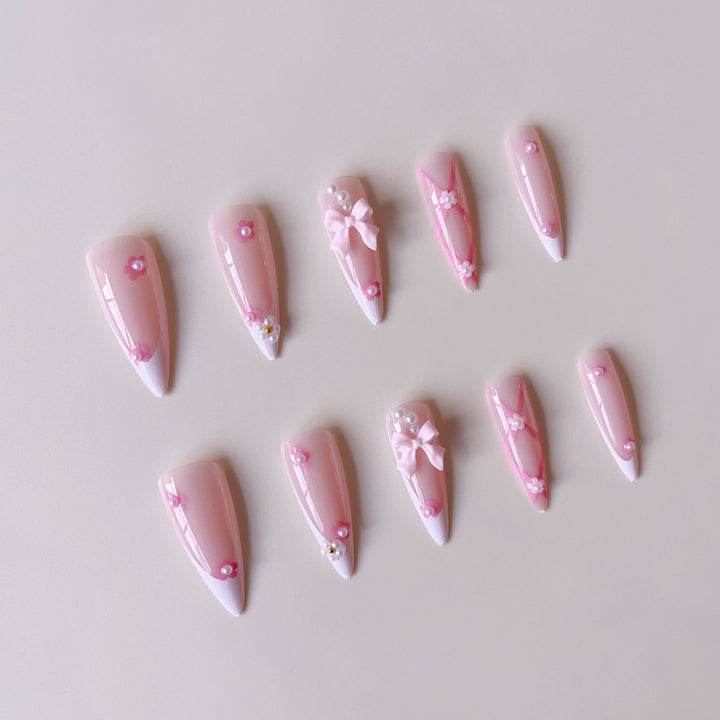 False nail set with playful 3D details and elegant accents Bowlift