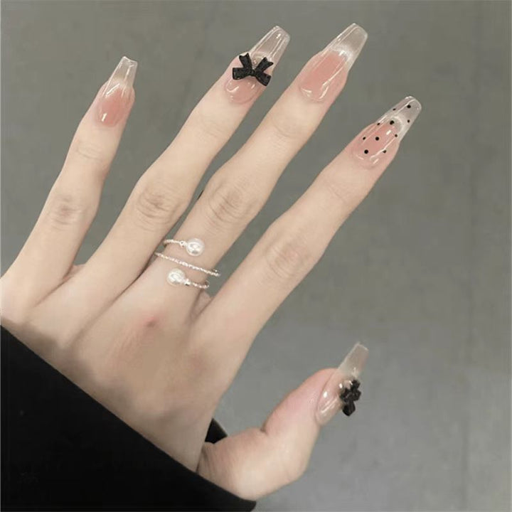 Artificial nails with playful bow design Bowlift